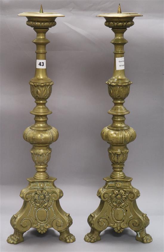 A pair of brass pricket candlesticks height 64cm